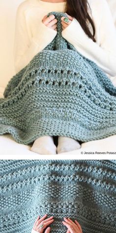 a woman laying on top of a bed covered in a blue crochet blanket