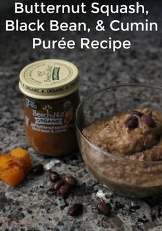 a bowl of peanut butter, black bean and cumin puree recipe next to a cup of coffee beans