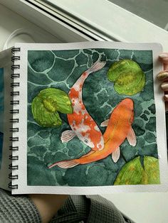 a drawing of a koi fish and lily pads