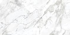 a white marble textured surface with grey veiners