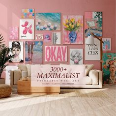 a living room with pink walls and pictures on the wall