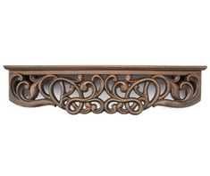 an ornate wooden shelf with decorative carvings on the top and bottom, made out of wood