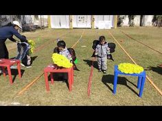 three children are playing with plastic chairs and balls