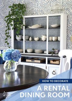 the dining room is decorated in blue and white