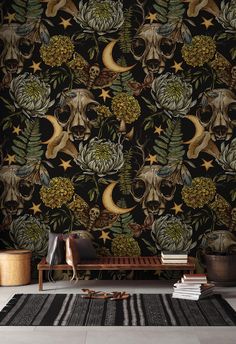 the wallpaper is decorated with skulls, flowers and stars in black colors on a dark background