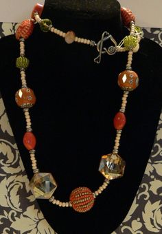 "CLEARANCE, orange necklace, Fashion necklace, Orange and lime green, orange and cream, statement necklace, boho necklace, gift Orange, lime green and cream necklace of faceted glass beads, lime green faceted crystal, orange ceramic discs, micro beaded creamy orange beads, faceted crystal beads, oval orange ceramic beads, lime green seed-beaded bead, orange clay  bead with silver embellishments, smoky orange faceted stop sign crystals and large orange and gold beaded focal bead on a strand of cr Sand Dollar Necklace, Handmade Statement Necklace, Boho Chic Necklace, Necklace Orange, Autumn Necklace, Orange Necklace, Casual Earrings, Fayetteville Nc, Unusual Earrings