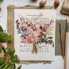 a card with flowers and music notes on it