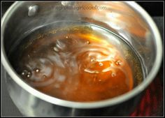 a pot filled with liquid sitting on top of a stove