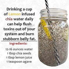 a jar filled with chia seeds next to a lemon slice and a straw in it