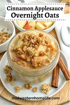 cinnamon applesauce overnight oats in a glass jar on a plate with cinnamon sticks