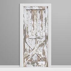 an old white door with wooden slats