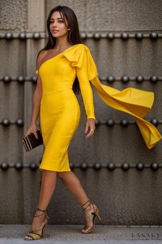 a woman in a yellow dress is walking down the street with her hand on her hip