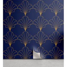 an art deco wallpaper design with gold scallops on a dark blue background