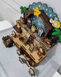 a nativity scene is displayed on a table