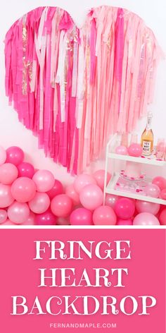 pink heart shaped balloons and streamers with the words fringe heart back drop on it