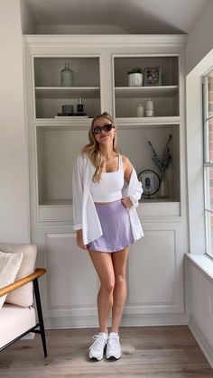 Tennis skirt atleisure outfit for summer! Athletic Skirt Outfit Ideas, Summer Tennis Skirt Outfit, Tennis Skirt Casual Outfit, Tennis Skirt Outfit Summer Street Styles, Tennis Skirt Outfit Street Style Summer, Purple Tennis Skirt Outfit, Tennis Skort Outfit, Tennis Skirt Outfit Casual, Colorful Socks Outfit