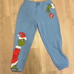 The Grinch Pink(Mas) Line Blue Sweatpants For Women, With Pockets. Great For Lounging Around. Relaxed Fit, Very Comfortable. Women's Medium. Grinch Pants, Black Velvet Outfit, Camo Jogger Pants, Sweatpants For Women, Lululemon Joggers, Blue Sweatpants, Camo Joggers, Velvet Clothes, Jersey Pants