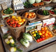 various fruits and vegetables are on display in baskets