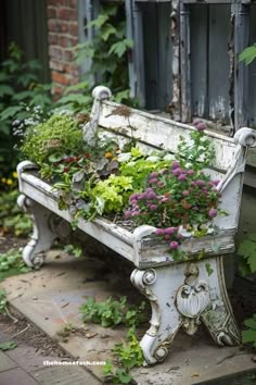 an old bench is filled with flowers and plants