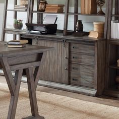 the sideboard is made from wood and has two drawers, one with an open door