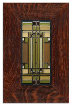 a wooden frame with an art deco design on it's sides and the top part of the frame painted brown