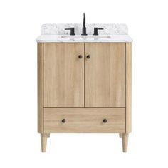 a bathroom vanity with marble top and two drawers on one side, the sink is white