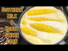 corn on the cob being cooked in a skillet with milk and honey sweet corn