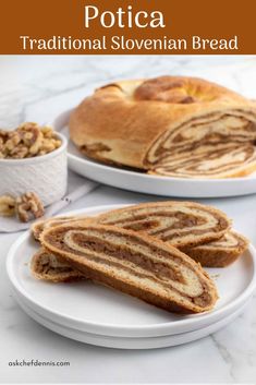 two white plates topped with slices of cinnamon roll next to a bowl of walnuts