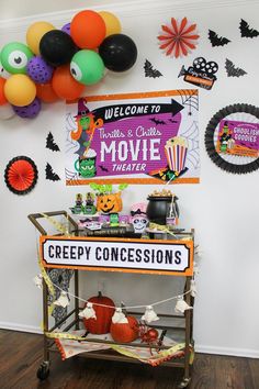 a halloween themed movie theater party with balloons and decorations