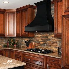 a kitchen with wooden cabinets and granite counter tops