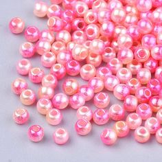 some pink beads are laying on a table