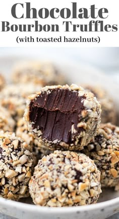 chocolate bourbon truffles with toasted hazelnuts in a white bowl on a table