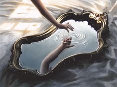 a woman's reflection in a mirror with her hand reaching for the water below