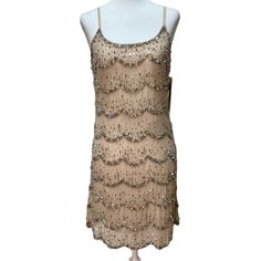 Alice + Olivia Beaded/Sequin Embellished Cocktail Dress Xs Nude/Beige In Color Gold, Silver, Metallic Gray Beads & Sequins Adjustable Spaghetti Straps Fully Lined Approximately 33 Inches In Length Gorgeous Dress! The Pictures Don’t Do It Justice! Glamorous Beaded Sleeveless Sequin Dress, Glamorous Beaded Flapper Dress, Champagne Embellished Sequin Evening Dress, Summer Cocktail Embellished Flapper Dress, Embellished Summer Flapper Dress For Evening, Summer Beaded Flapper Dress For Cocktail, Summer Beaded Cocktail Flapper Dress, Glamorous Sleeveless Beaded Flapper Dress, Glamorous Embellished Summer Flapper Dress