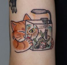 the cat is looking at the water faucet tattoo on the arm and leg