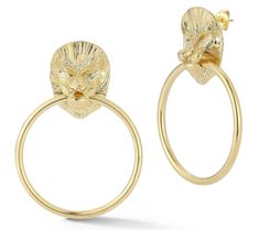 a pair of gold hoop earrings with an animal head on the front and back of each ear