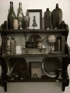 an old shelf with various items on it