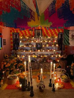 the altar is decorated with candles and flowers