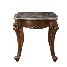 an antique wooden table with marble top