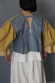 SASAKI-CHIHO  "Japanese antique cotton Kataginu blouse with pierrot sleeves" Made by Chiho Sasaki Material:Japanese antique cotton Color:Yellow and gray The front of this blouse does not close. Size Shoulder to shoulder: 17.3 inch (44 cm) Shoulder to Cuff: 21.2 inch (54 cm) Chest: Free Dress length: 18.5 inch (47 cm) Model:5'2"(157 cm) Thank you. Japanese Pants, Free Dress, Free Dresses, Pant Suit, Traditional Costume, Japanese Antiques, Grey Shorts, Japanese Traditional, Womens Clothing Tops