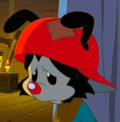 a cartoon character wearing a red hat and blue shirt