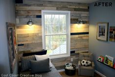 a living room filled with furniture and a large window covered in wood planked walls