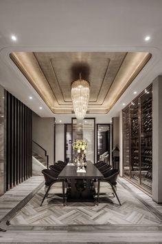 an elegant dining room with marble flooring and chandelier hanging from the ceiling