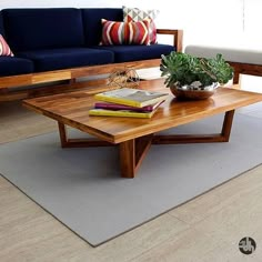 a living room with two couches and a coffee table in front of the couch