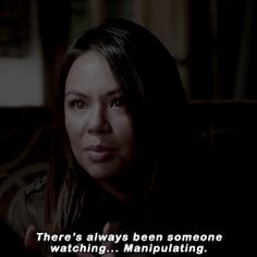 a woman sitting on top of a couch next to a book shelf with a quote from the vampire