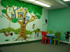 children's playroom with tree mural and colorful chairs