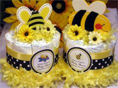 two baby bee diapers with yellow flowers in front of sunflowers and bees