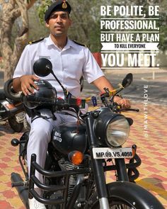 a man sitting on top of a motorcycle next to a brick road with a quote written above it