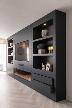 a modern living room with fireplace and entertainment center