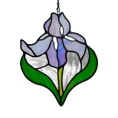 a stained glass flower hanging from a chain